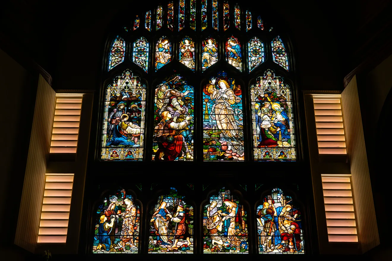 A chancel stained-glass window in the Tiffany tradition