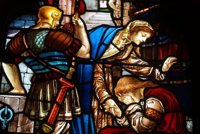 A stained-glass window along the nave